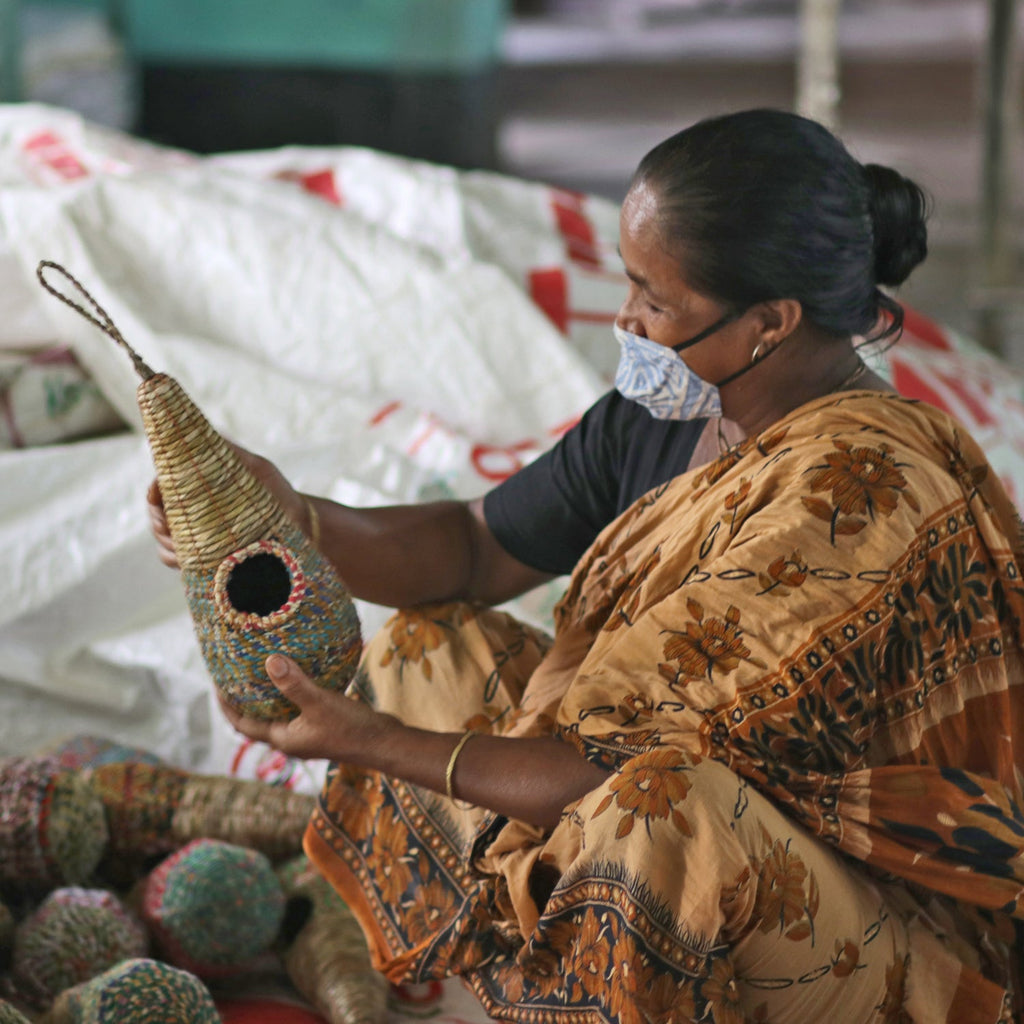 Bangladesh lady making artisan bird nesters